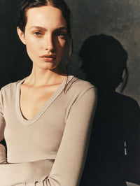 Close editorial view of the Enza Costa Fluid Silk Rib Essential U Top in Light Grey showing the fine rib.