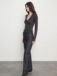 Side view of the Enza Costa Fluid Silk Rib Essential U Top in Phantom, fitted through the body with long sleeves.