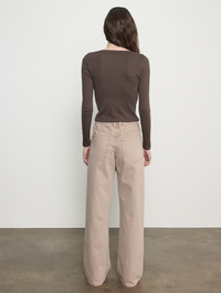 Back view of the Supima Cotton V-neck Cardigan in Espresso by Enza Costa, paired with cream jeans