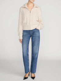 Full length front view of the FRAME Airy Lurex Quarter Zip sweater in Biscuit styled with straight leg denim.