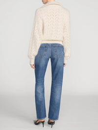 Back view of the FRAME Airy Lurex Quarter Zip sweater in Biscuit showing the open chevron knit.