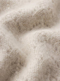 Fabric close up of the wool and cashmere lurex knit on the FRAME Airy Lurex Quarter Zip sweater in Biscuit.