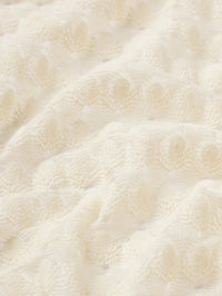 Fabric detail of the open bubble stitch knit on the FRAME Bubble Stitch Shirt in Cream