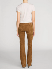Back view of The Contrast Stitch Baby Tee in Bone by FRAME, styled with camel suede pants