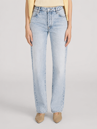 Front view of The Essential jeans in Air light wash by FRAME, styled with a cream top