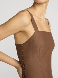 Side view of the Garden Dress in Moss Brown by FRAME, featuring button-front closure detail