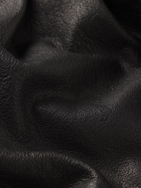 Close-up of luxe leather texture on the Structural Short in Black by FRAME