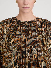 Close-up of the gathered neckline and metallic print on the FRAME Pleated Bubble Top in Abstract Leopard