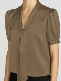 Front view of the Sonnet Blouse in Moss by FRAME with puffed sleeves and tie neckline
