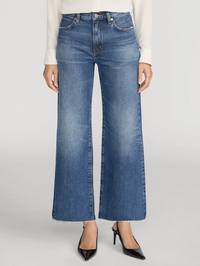 Front view of the Swing Jean in Lucky Raw After by FRAME, styled with a cream knit and black pumps