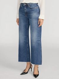 Front view of the Swing Jean in Lucky Raw After by FRAME, styled with a white long-sleeve top