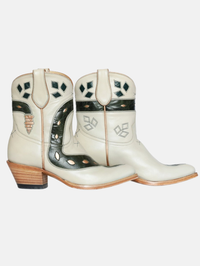 Side view of the Sneaky Snake Women's Cowboy Boot in Cream featuring black snake inlay and wood heel by Fräulein