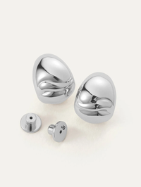 Flat lay of the Nelle Hoops in High Polish Silver by Jenny Bird, showing front and back components