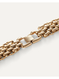 Flat lay of the Penelope Bracelet in high polish gold by Jenny Bird, showcasing chunky chain links and clasp detail