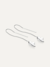 Flat lay of the Puffy Heart Threaders in High Polish Silver by JENNY BIRD