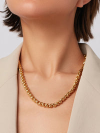 Close-up of the twisted chain detail on the Rizzo Necklace in High Polish Gold by Jenny Bird
