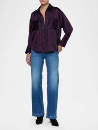 Full-length view of the L'AGENCE Eliora Relaxed Blouse in Midnight/Deep Sangria Even Stripe styled with wide-leg jeans.