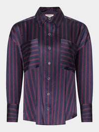 Flat lay of the L'AGENCE Eliora Relaxed Blouse in Midnight/Deep Sangria Even Stripe with horizontal-stripe pockets.