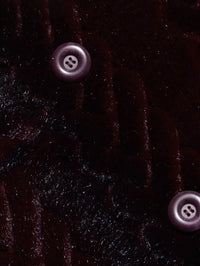 Close up of the braid faux fur and buttons on the L'AGENCE Icelyn Long Coat in Burgundy/Dark Burgundy