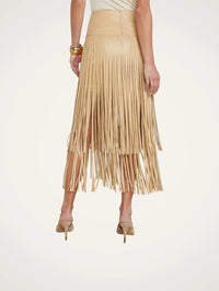Back view of the L'AGENCE Karolina Fringe Skirt in Croissant showing the invisible back zip.