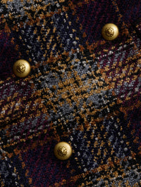 Close-up of gold lion buttons and plaid tweed weave on the L'AGENCE Kolina Long Coat in Navy/Burgundy Multi.