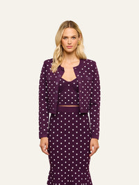 Front view of the L'AGENCE Kota Jacquard Cardigan in Dark Plum/Ivory Polka Dot worn open over a matching top
