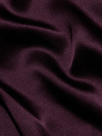Close-up of the silk charmeuse fabric of the L'AGENCE Lexi Silk Camisole in Deep Sangria