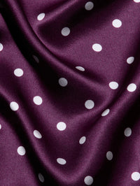Close-up of the Dark Plum/Ivory Polka Dot silk charmeuse on the L'AGENCE Sayla dress