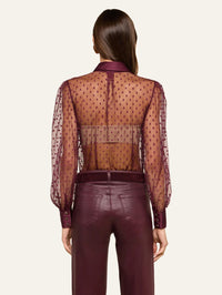 Back view of the L'AGENCE Sophie Swiss Dot Blouse in Deep Sangria with buttoned satin cuffs