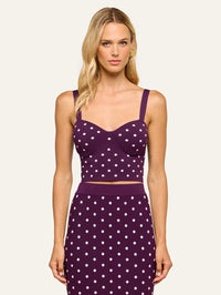 Front view of the L'AGENCE Tula Knit Bra Top in Dark Plum/Ivory Polka Dot worn with the matching skirt