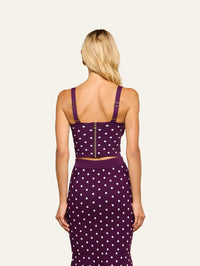 Back view of the L'AGENCE Tula Knit Bra Top in Dark Plum/Ivory Polka Dot with exposed zip and adjustable straps