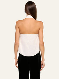 Back view of the L'AGENCE Wren Neck-Tie Top in White/Black showing the open back and curved hem