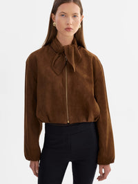 Front view of the LAMARQUE Anita Suede Bomber Jacket in Brown with the scarf collar tied at the neck.