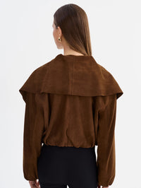 Back view of the LAMARQUE Anita Suede Bomber Jacket in Brown with the wide collar draped over the shoulders.