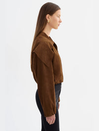 Side profile of the LAMARQUE Anita Suede Bomber Jacket in Brown showing the collar and gathered sleeve.