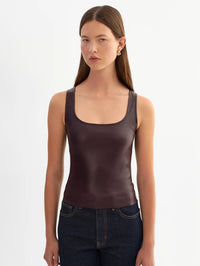 Front view of the LAMARQUE Cesia stretch leather tank in Vamp, worn with dark denim.