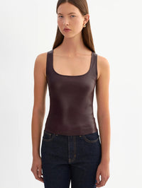 Front view of the LAMARQUE Cesia stretch leather tank in Vamp, worn with dark denim.