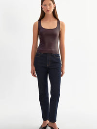 Full length front view of the LAMARQUE Cesia leather tank in Vamp tucked into dark jeans.
