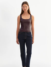 Full length front view of the LAMARQUE Cesia leather tank in Vamp tucked into dark jeans.