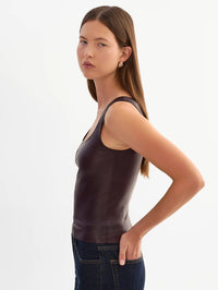 Side view of the LAMARQUE Cesia stretch leather tank in Vamp showing its close fit.