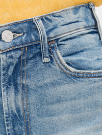 Close-up of the waistband and button detail on the Lil Hustler Roller Sneak Jean in I Confess by MOTHER