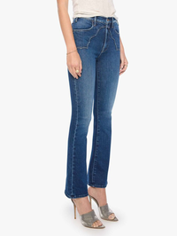 Side view of the Buckle Bunny Hustler Skimp Jean in Cosmic Cowgirl by MOTHER, styled with metallic heels