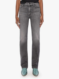 A model wearing a pair of dark gray high-waisted straight-leg jeans with a faded wash, paired with green snakeskin-patterned shoes, shown against a plain white background.