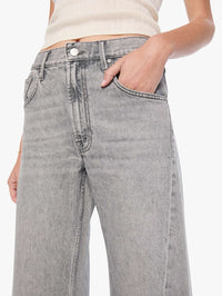 Close-up of the waistband, zip fly, and front pocket on MOTHER Lemon Twist Sneak jeans in Rocky Road.