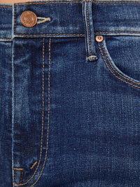 Fabric detail of the dark blue stretch denim on the MOTHER Weekender Jean in Backstage Pass