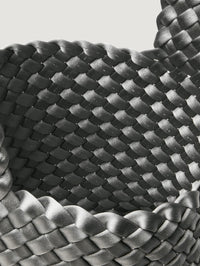 Interior close up of the handwoven satin on the NAGHEDI Kyoto Clutch in Graphite.