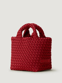 Side angle of the NAGHEDI St. Barths Petit Tote in Rosso showing the woven handles and red neoprene weave.