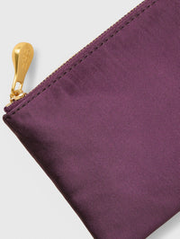 Detail of the satin zippered pouch included with the NAGHEDI St. Barths Petit Tote in Bisou.