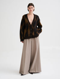 Full length view of the Roberto Collina ML Jacquard Animalier Cardigan in Brown with wide leg trousers