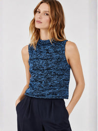 Front view of a model in the SABLYN Giada Roll Neck Tank in Coast Blue Multi with navy trousers